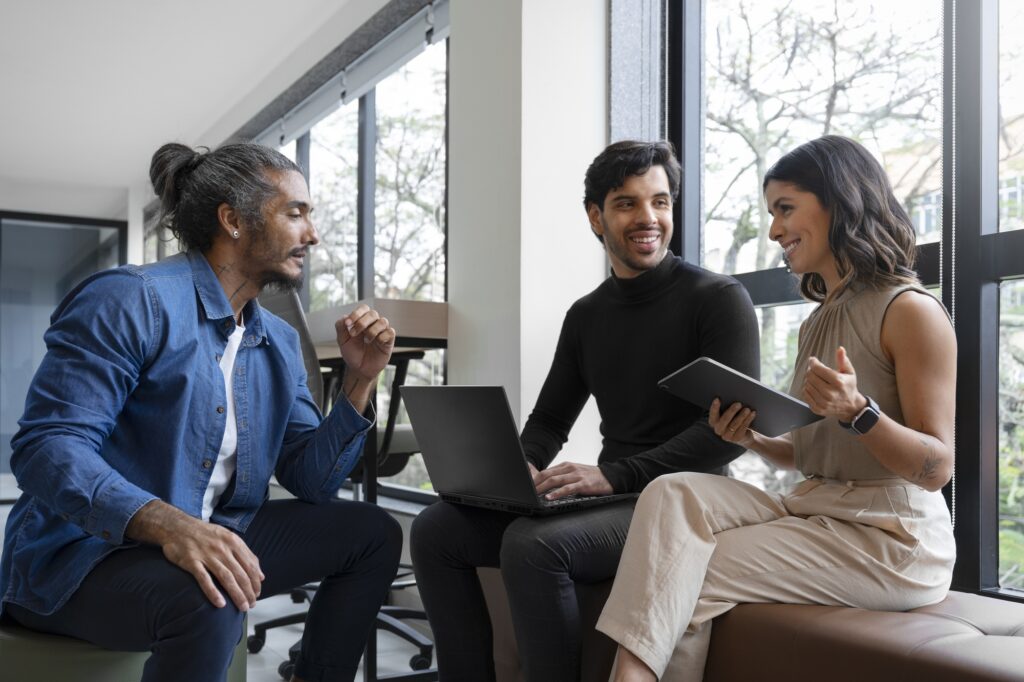 The CodeShooters team discussing project details with a client